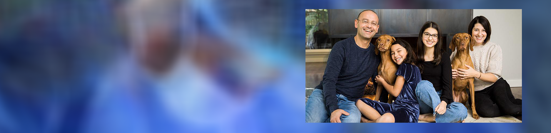 Manuel Ferreira with his wife, two daughters, and two family dogs