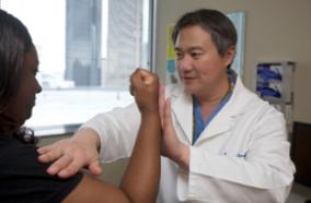 Dr. Zhang with a patient